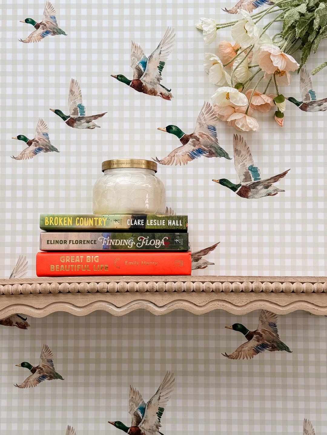 Mallard wallpaper with flying ducks over a soft gingham background in a calm, neutral styled space
