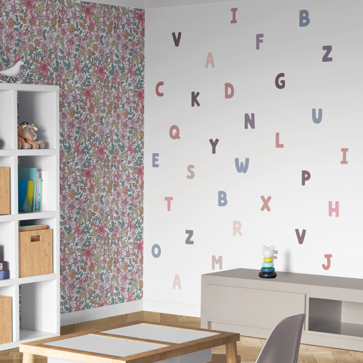 Children's room with floral wallpaper and alphabet letters on the wall.
