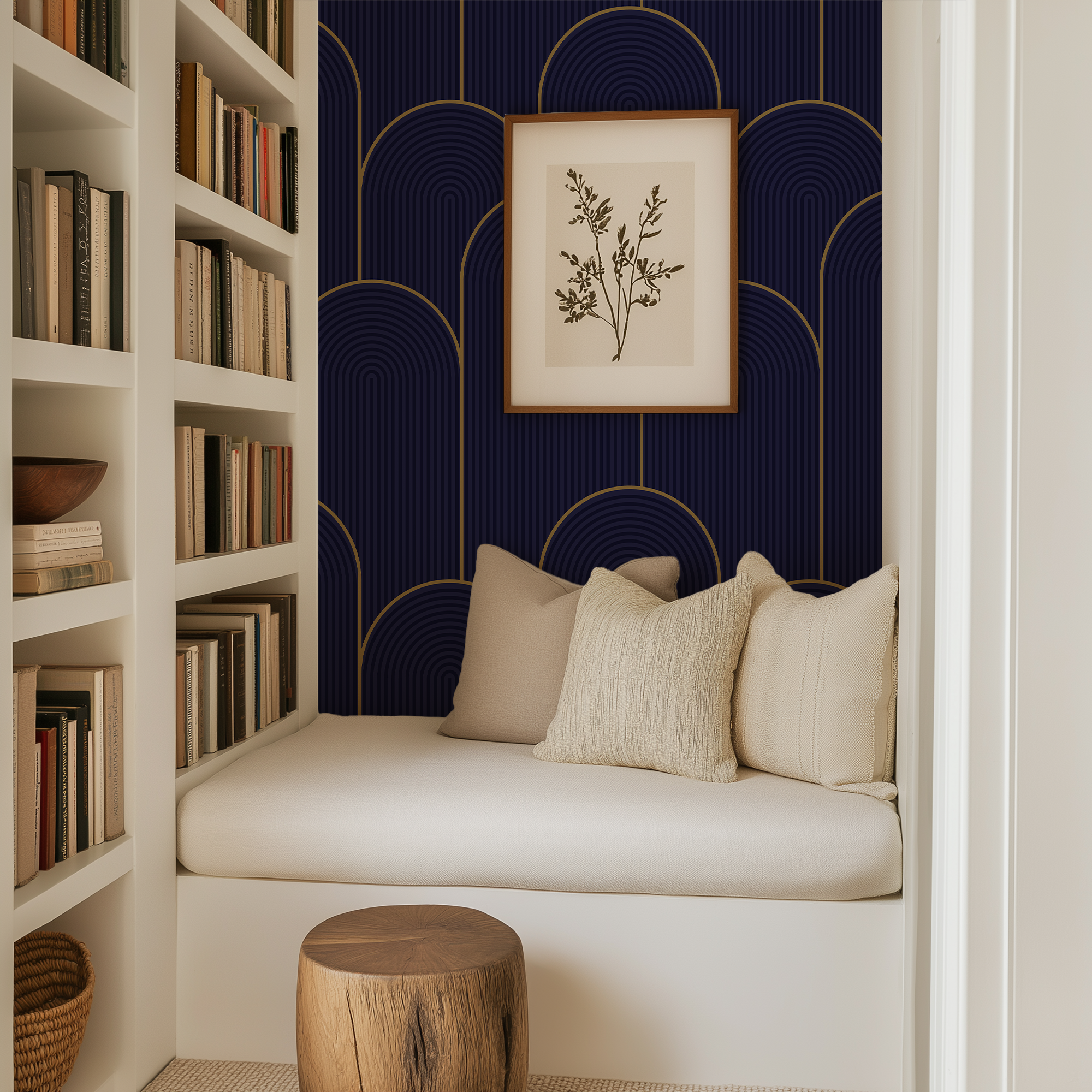 cozy reading nook featuring navy and gold arch wallpaper with cream bench cushions and built in bookshelves