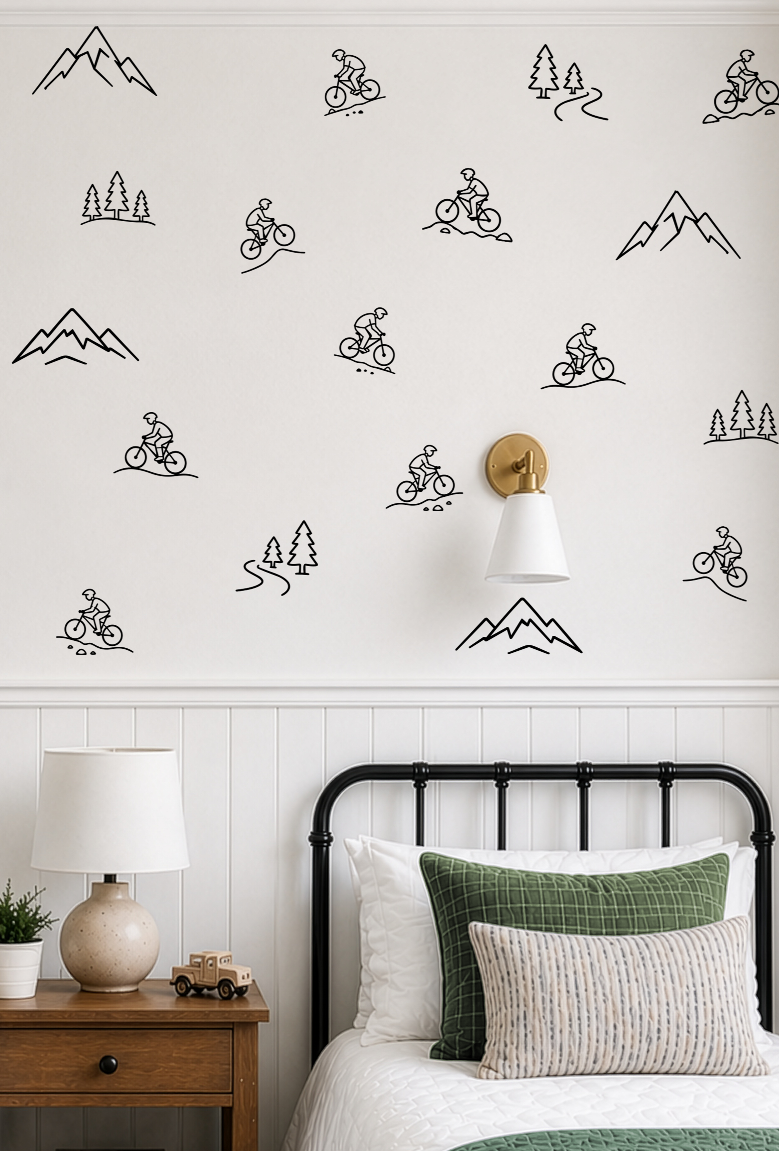 Simple mountain bike wall decals displayed in a modern boy's bedroom with mountain, forest, and biking outline wall stickers.