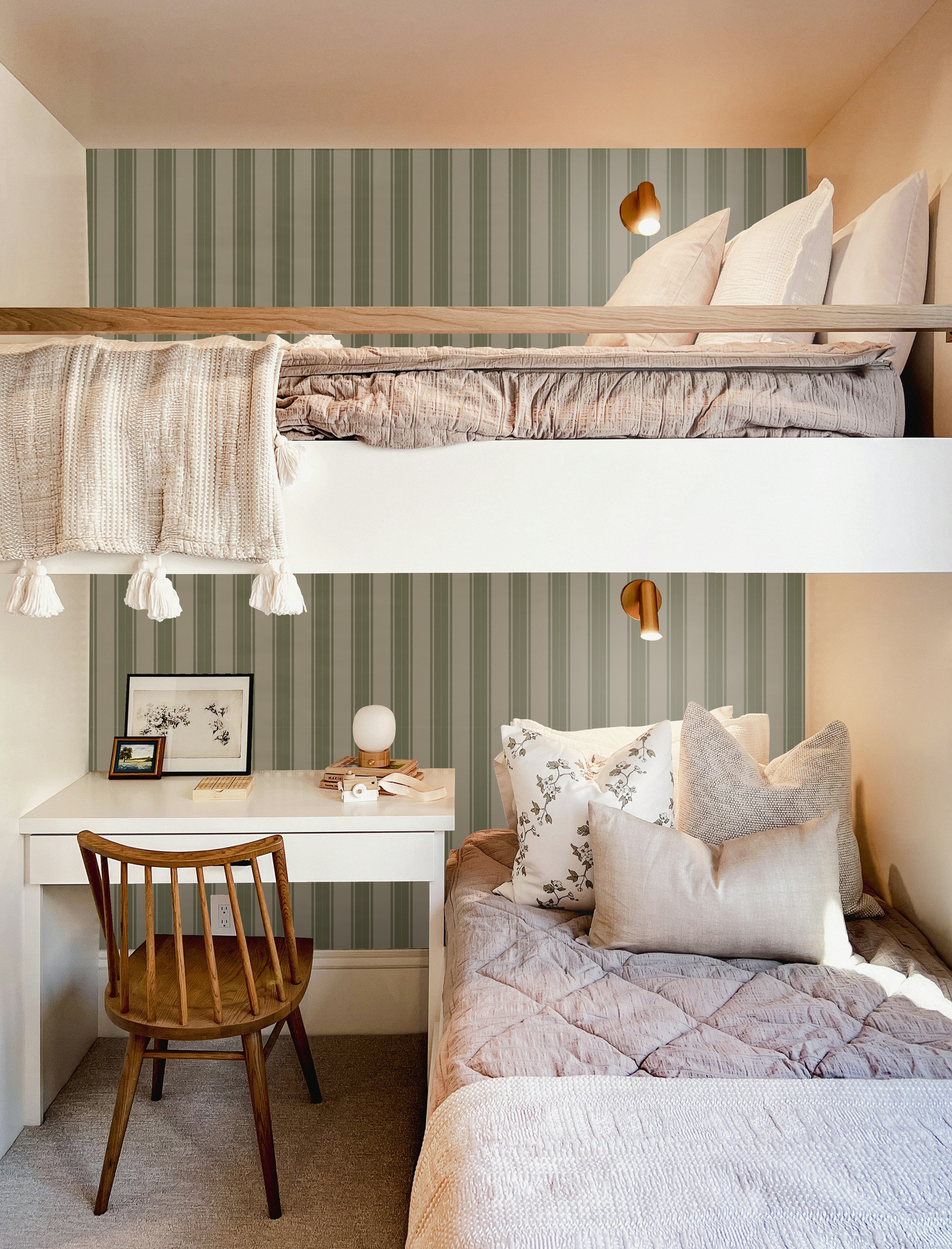 Boys' bedroom with green striped wallpaper, bunk beds, and a small desk workspace