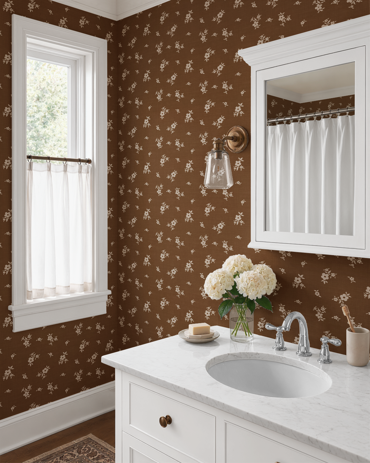 Brown Scattered Floral Wallpaper in a bright bathroom with white vanity, marble countertop, brass lighting, and vintage floral walls.