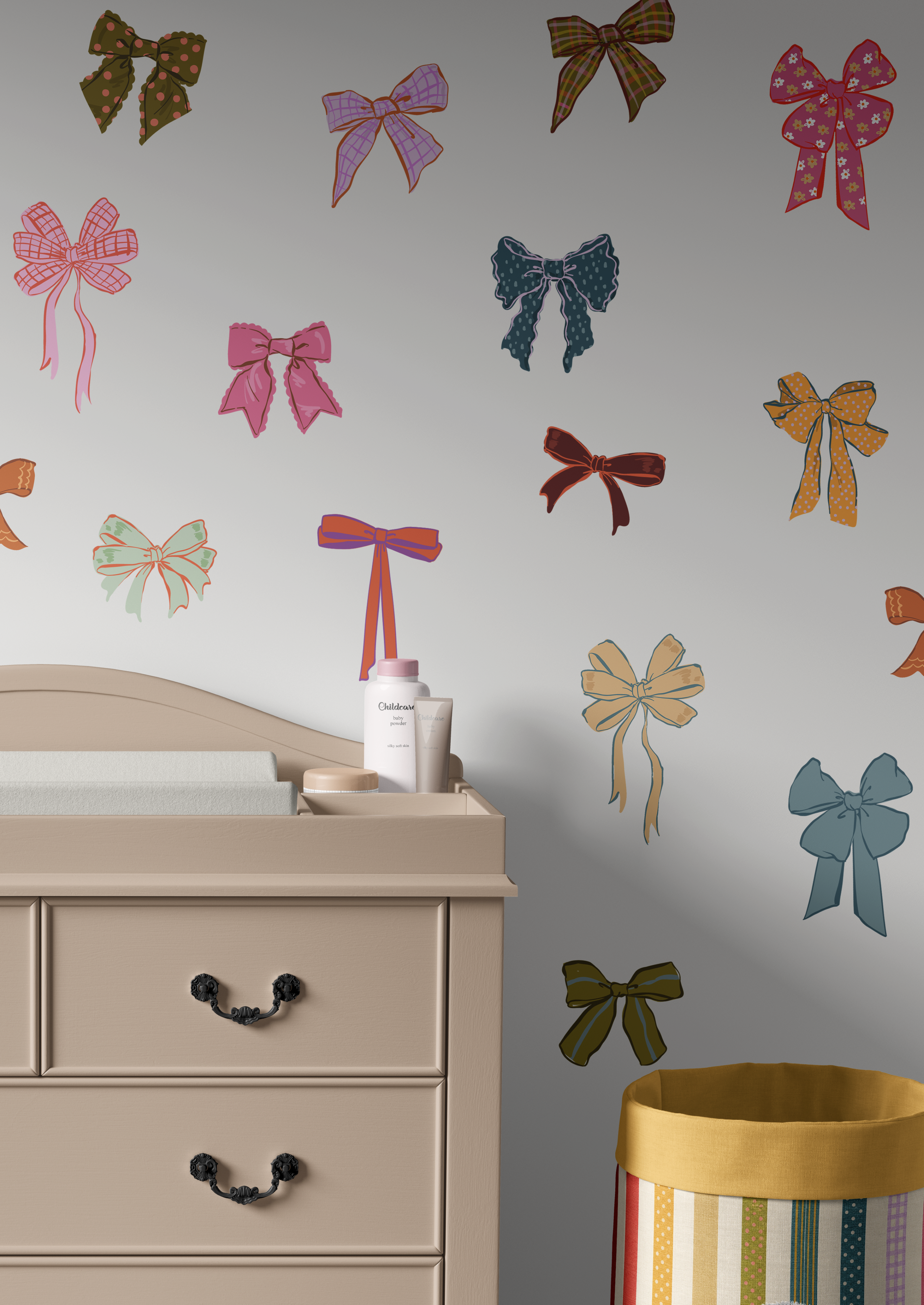 Colorful bow wall decals arranged on wall in neutral room with chair and basket, preppy nursery decor