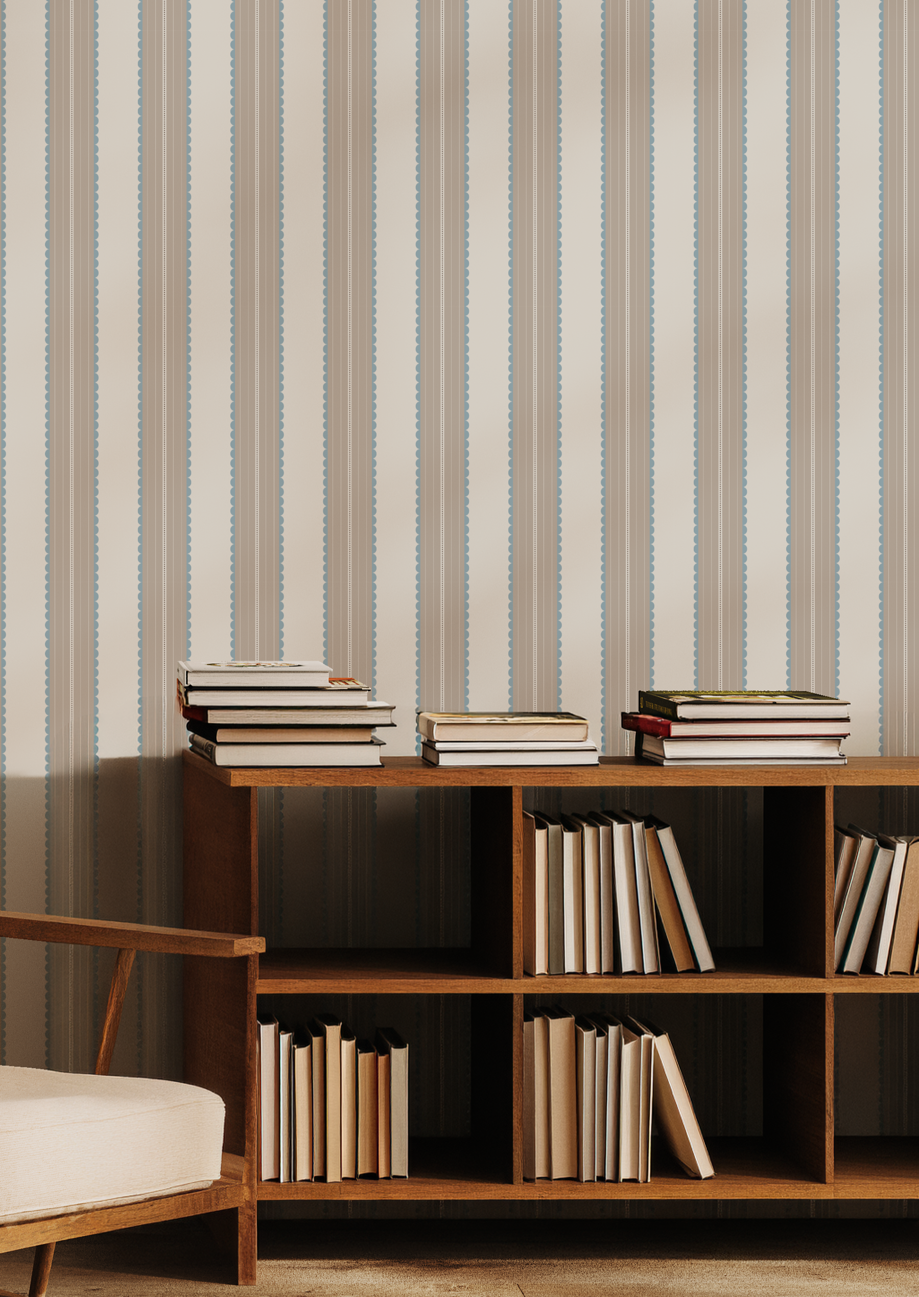 Wooden bookshelf with books against a stripe and scallop wallpaper