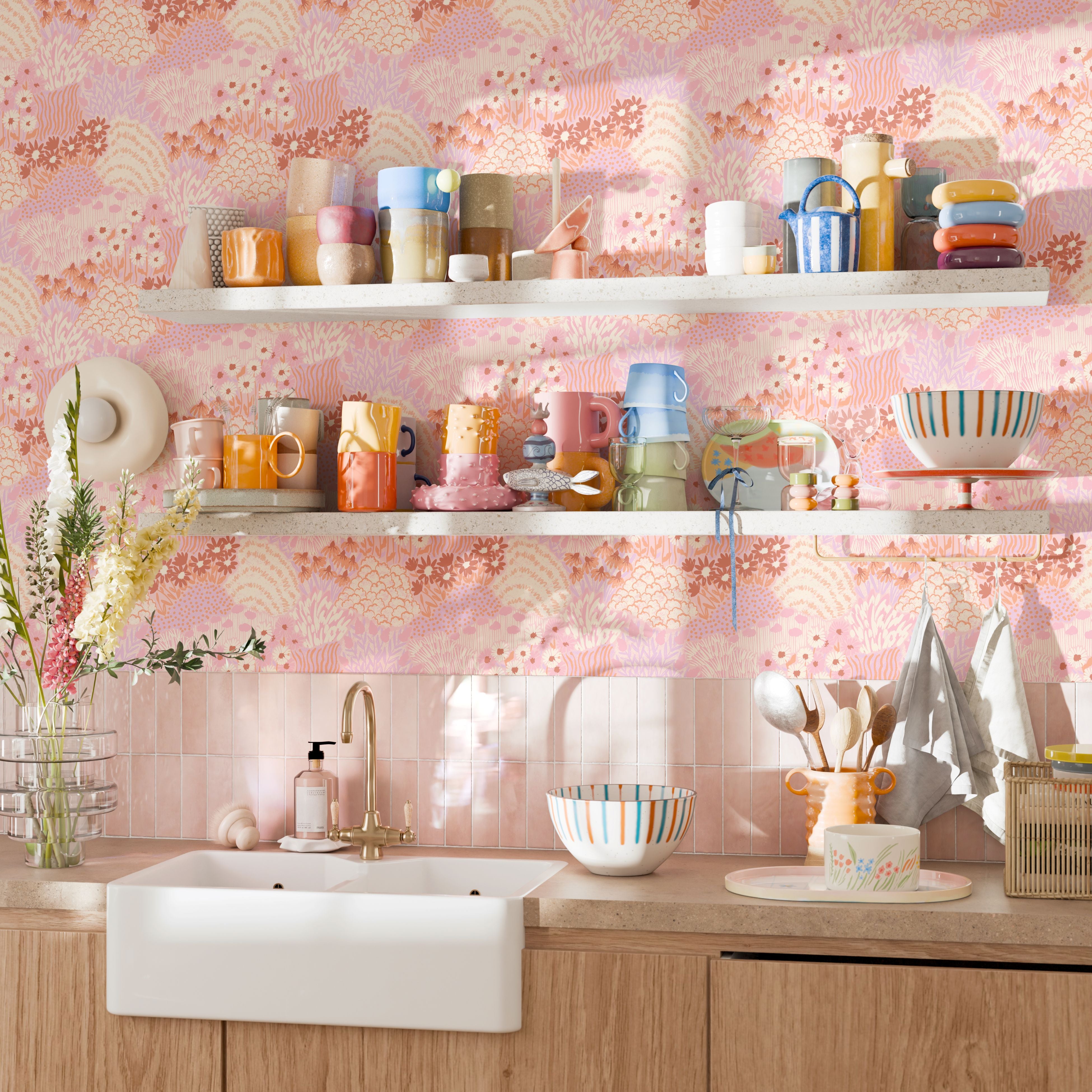 Open shelving and pastel kitchenware on a wall of Daydream floral wallpaper