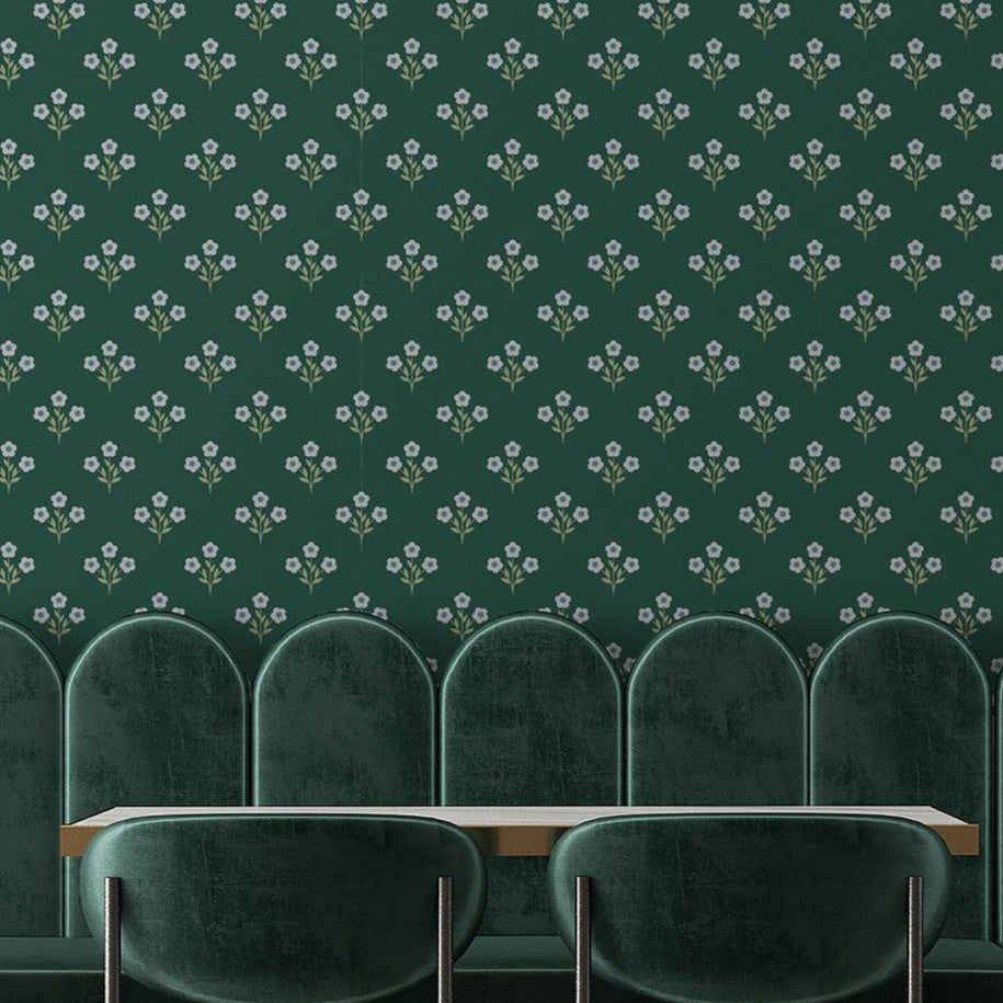 Repeating evergreen blossom floral wallpaper pattern featuring delicate white flowers on rich green backdrop