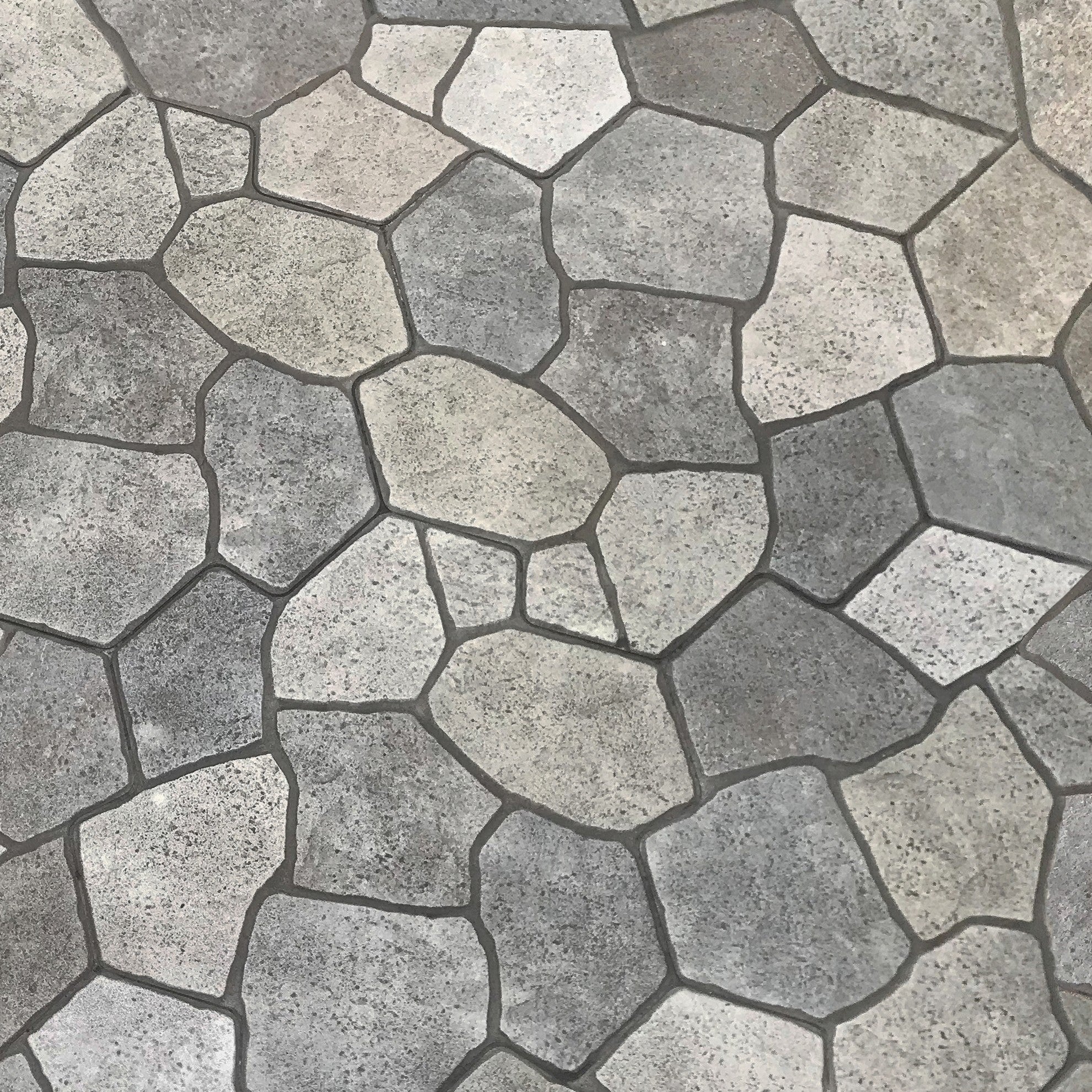 Flagstone tile wallpaper close-up, rustic grey stone pattern with natural textured look