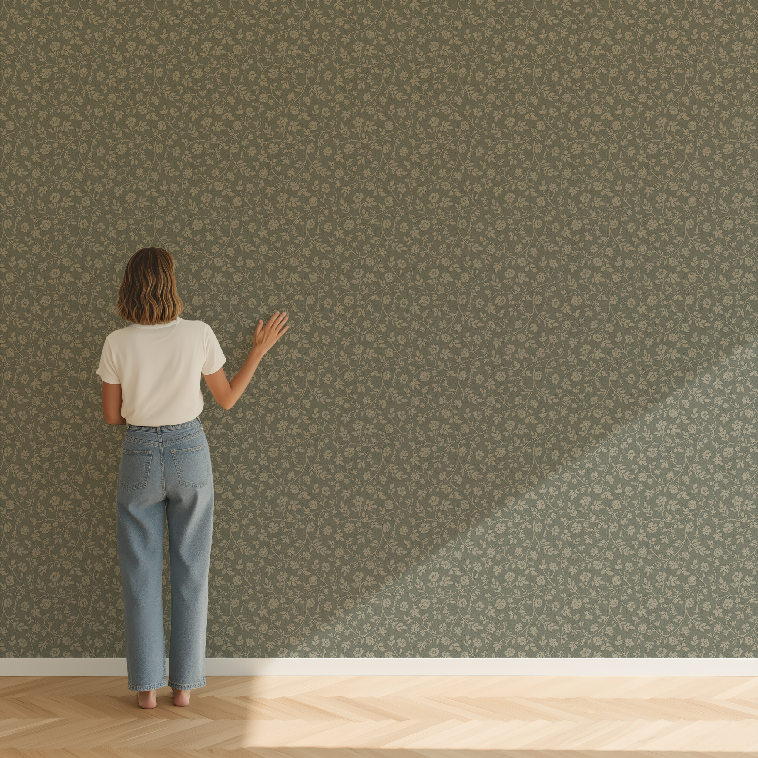 Woman standing in front of a wall of off green floral patterned wallpaper.