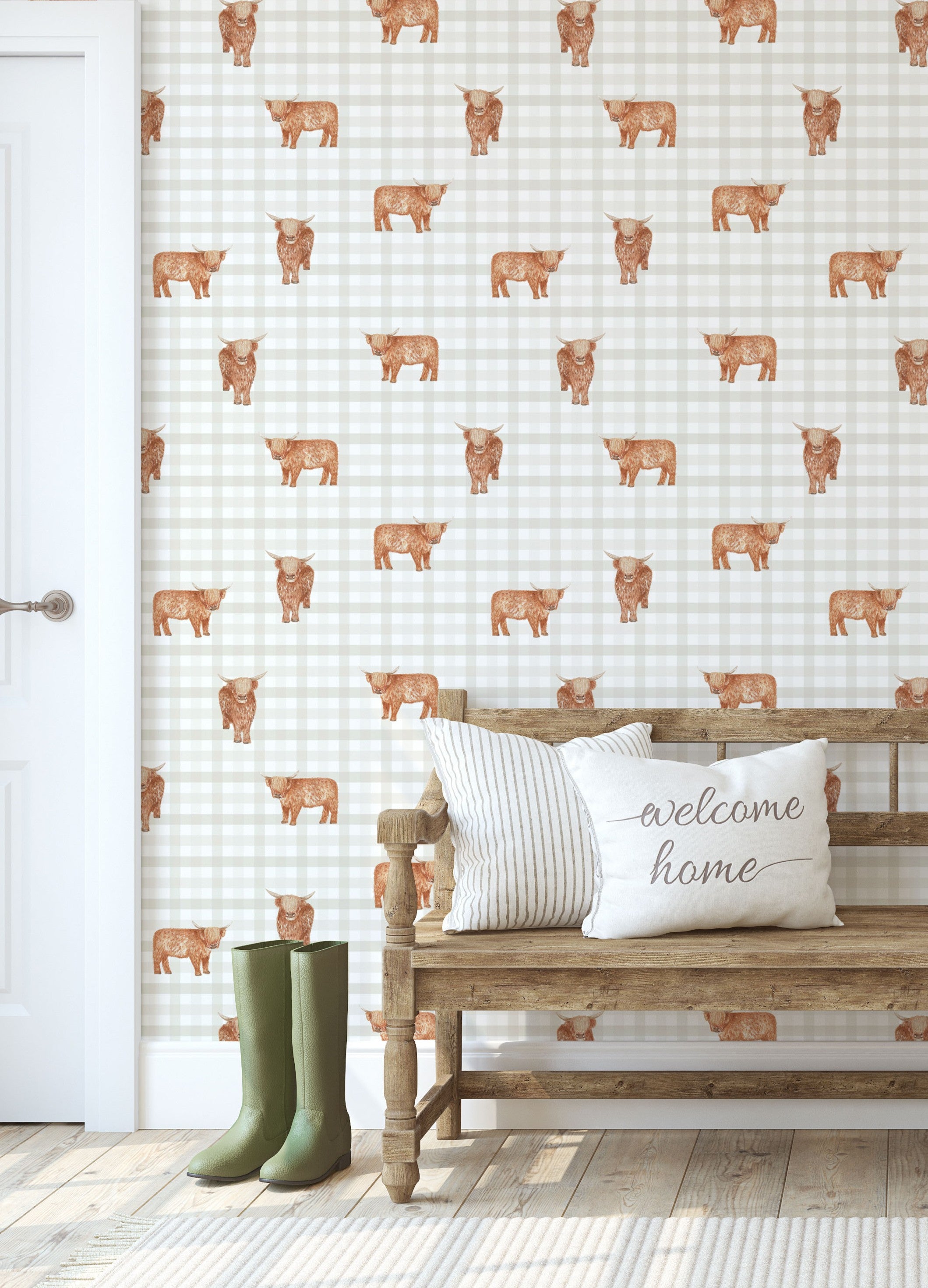 Wallpaper with highladn cow and gingham pattern in a room with a wooden bench and green boots.
