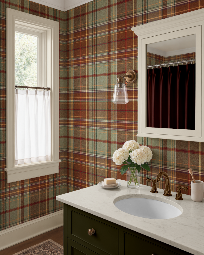 Traditional tartan plaid wallpaper in a bathroom with dark olive vanity, brass fixtures and warm cottage decor