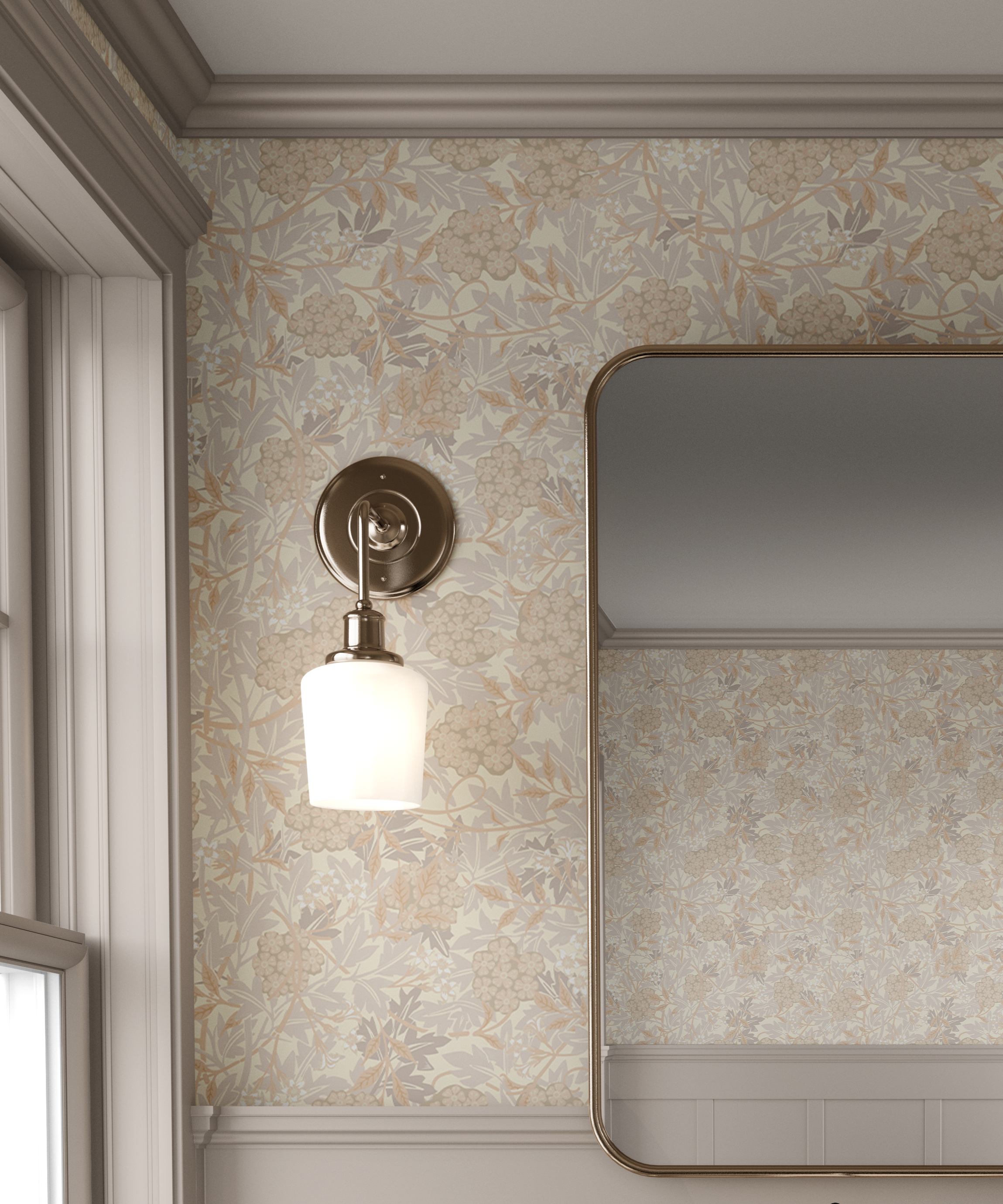 A wall-mounted sconce with a warm brass finish and a frosted glass shade, installed on patterned wallpaper next to a mirror in a styled interior setting.