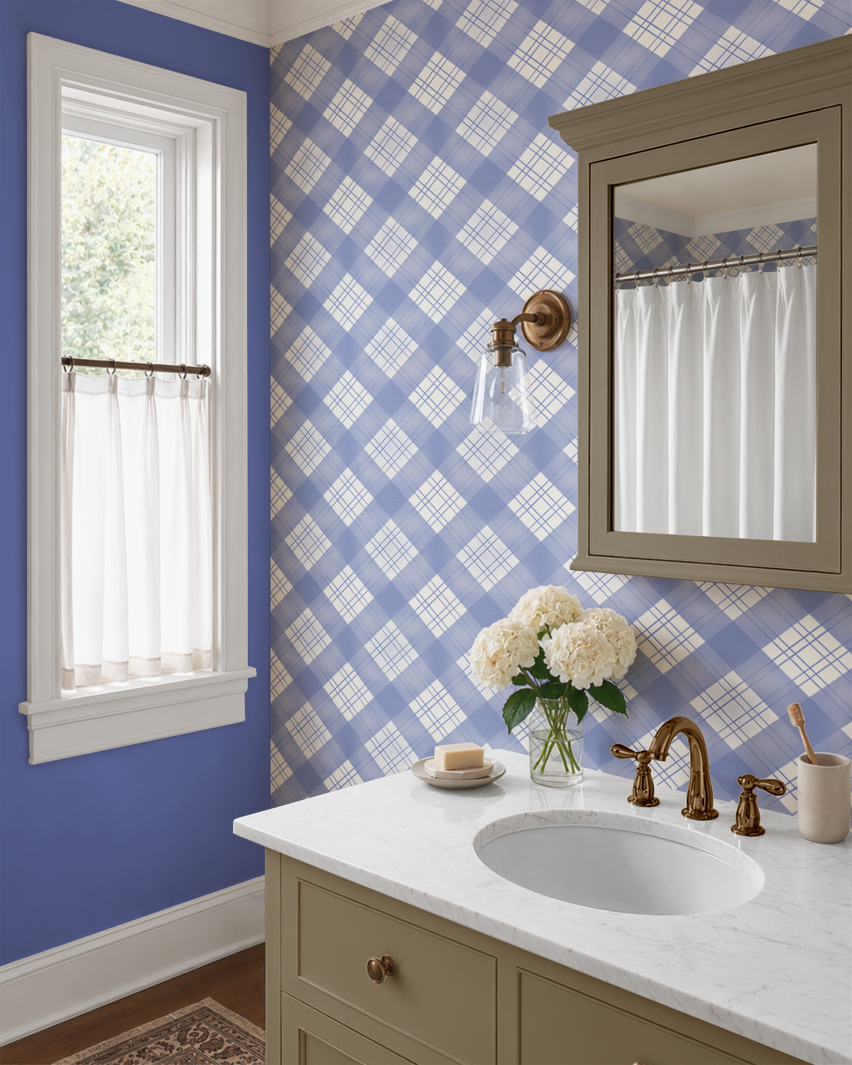 Blue and white plaid wallpaper styled in a traditional bathroom with brass fixtures, marble countertop, taupe vanity and periwinkle painted walls.