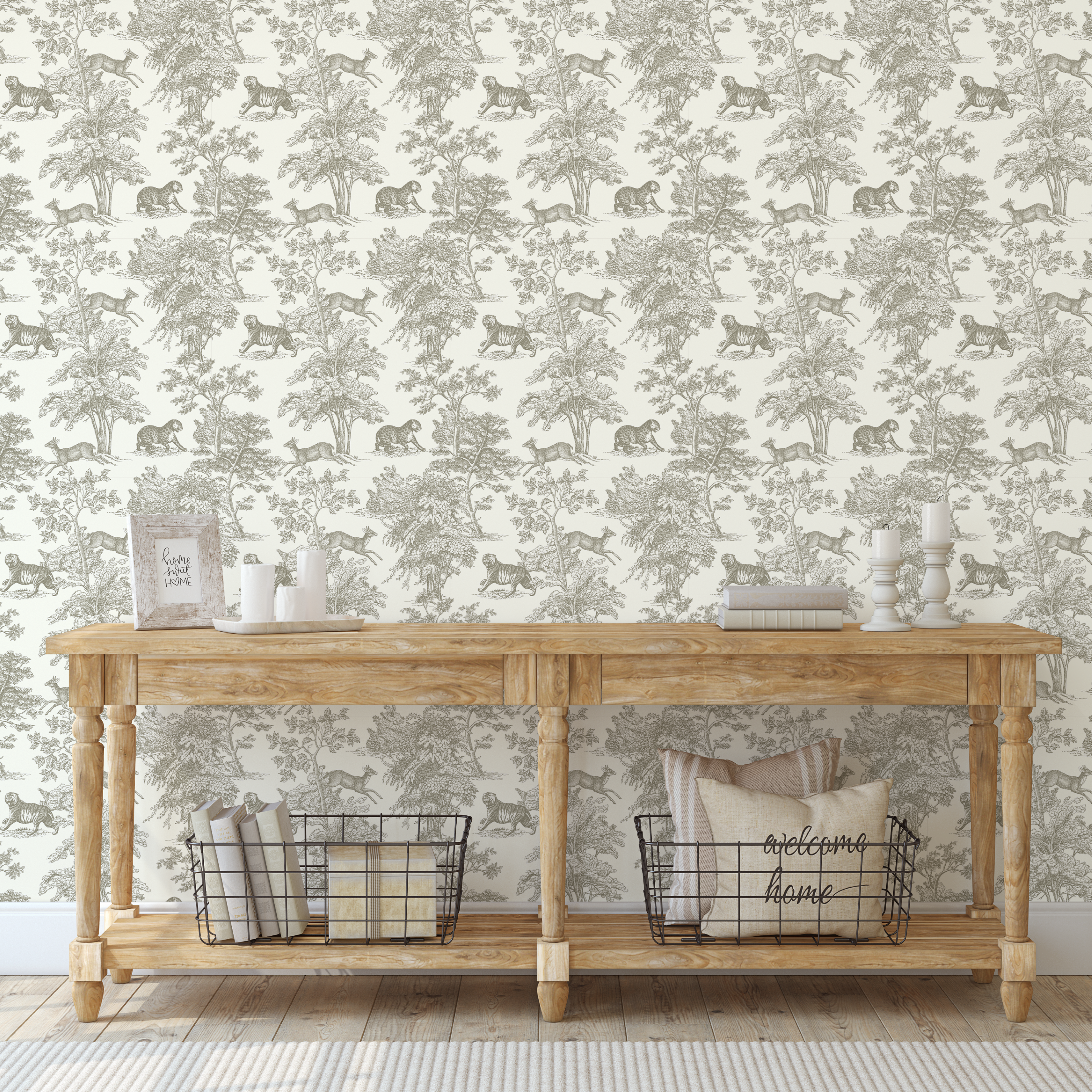 Neutral safari toile wallpaper styled in an entryway with wooden console table and taupe wildlife toile pattern