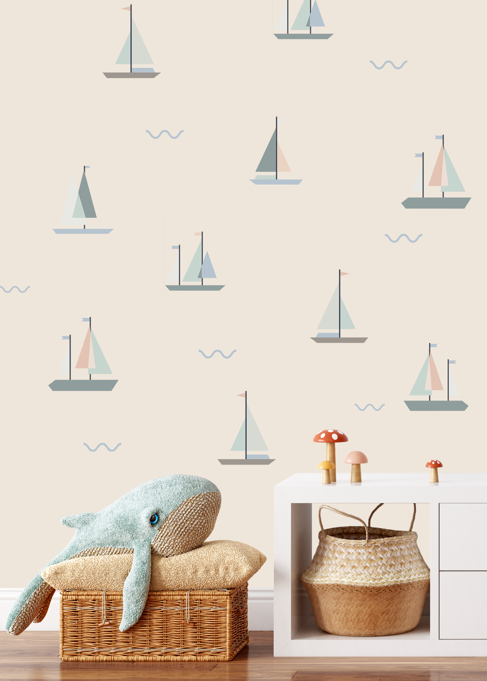 Nursery with neutral sailboat wall decals and plush whale decor