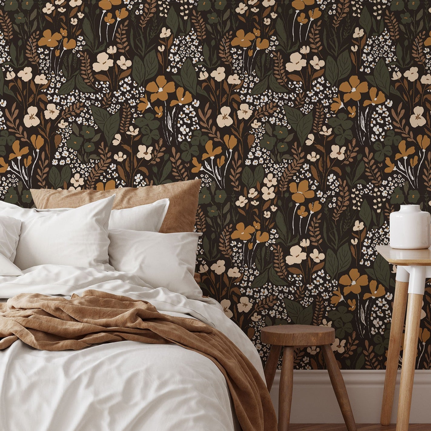 Dark botanical wallpaper adding warmth and depth to a modern neutral interior