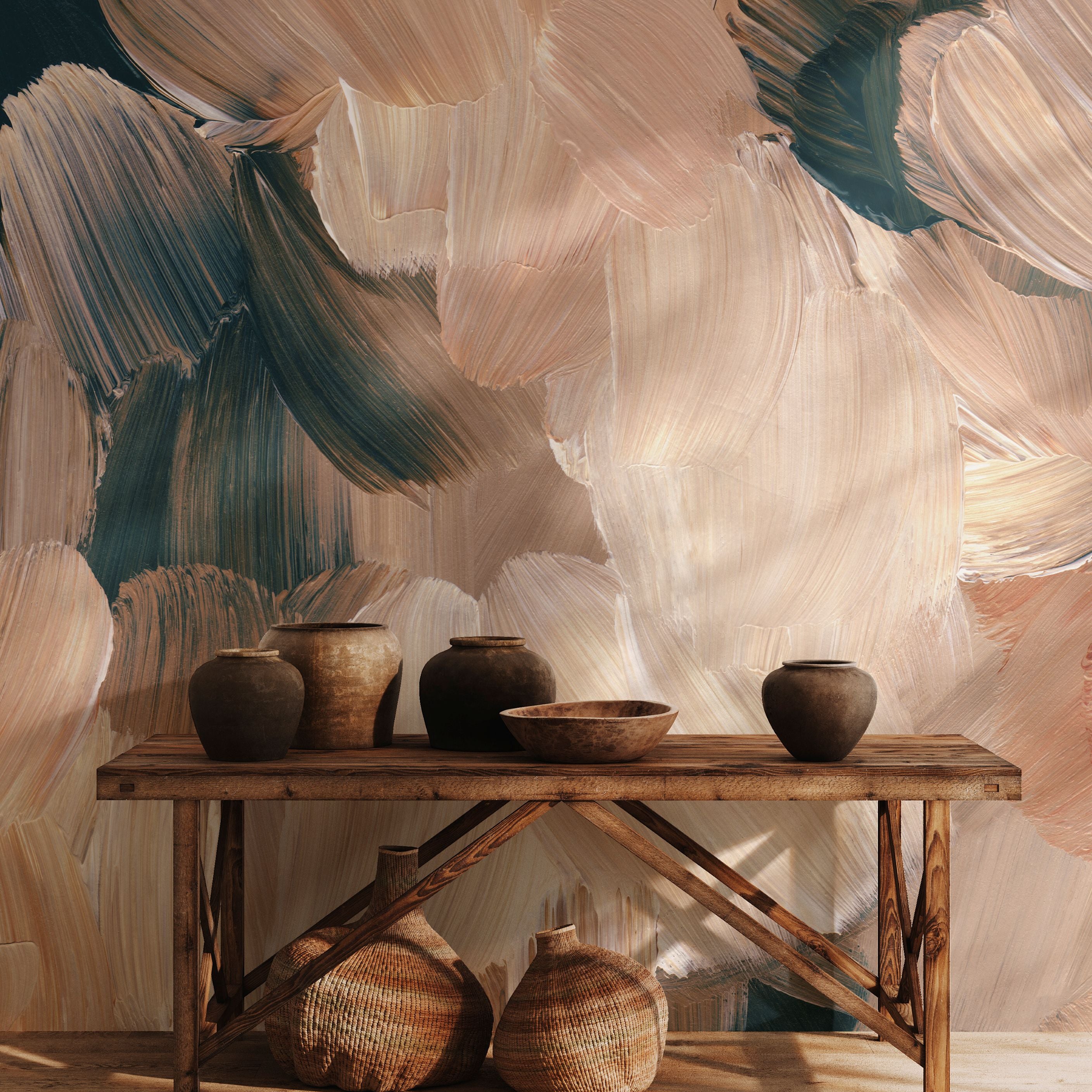 Abstract brushstroke wall mural in earthy beige, tan, and dark green tones styled with pottery and wooden console table