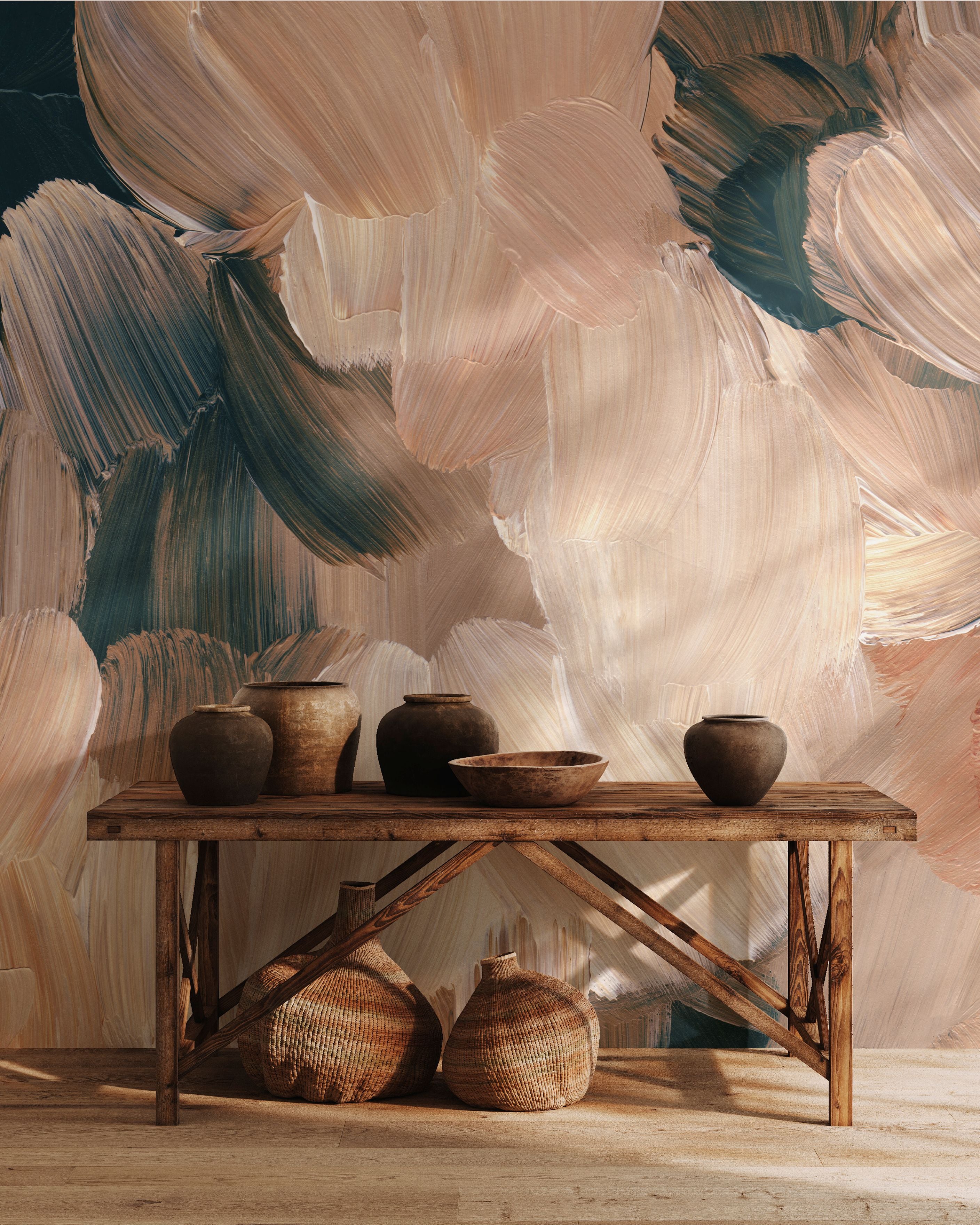 Abstract brushstroke wall mural in earthy beige, tan, and dark green tones styled with pottery and wooden console table