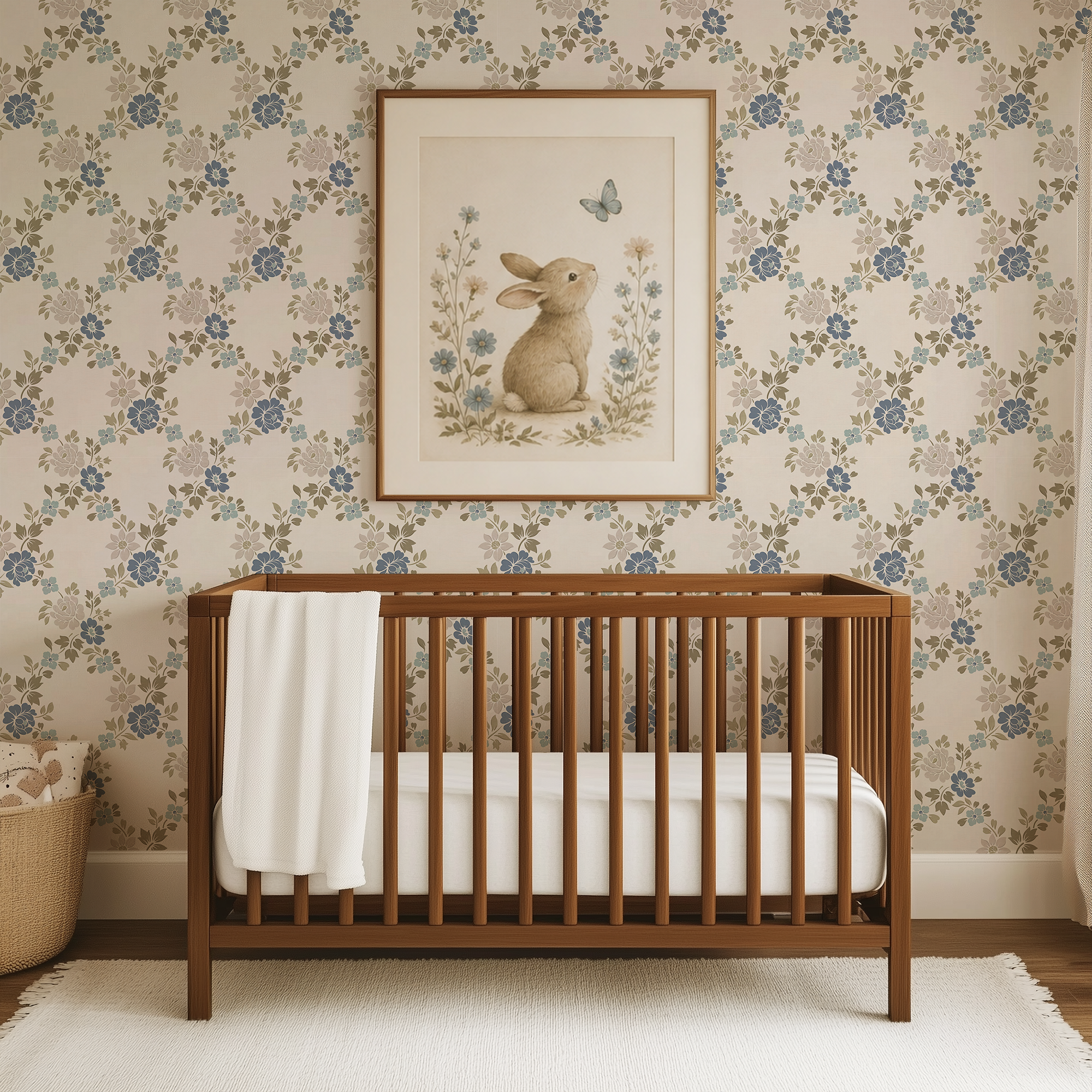 Vintage blue green floral trellis wallpaper in a nursery with warm wood crib and whimsical bunny artwork.