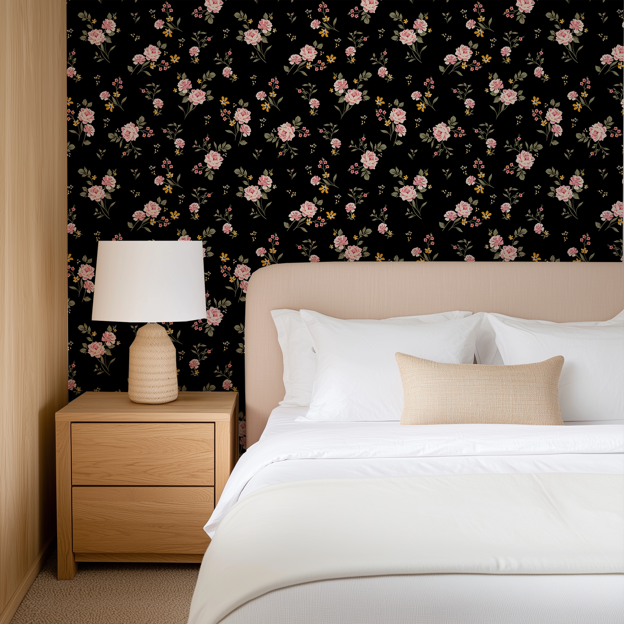 Noir black floral wallpaper featuring scattered pink roses and small wildflowers styled behind a neutral upholstered bed.