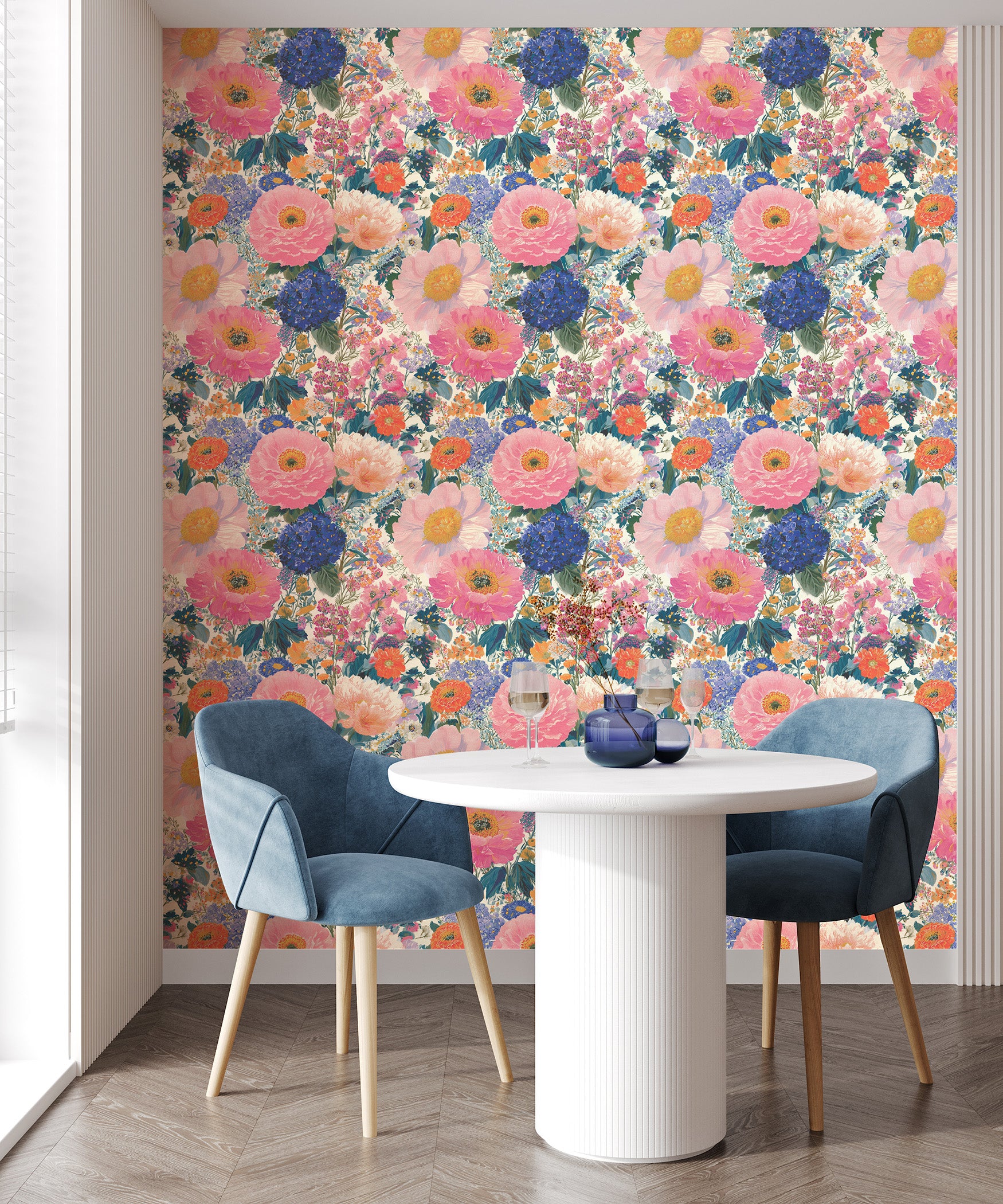Colorful poppy floral wallpaper with oversized pink peonies, blue hydrangeas and orange blooms in a maximalist botanical pattern