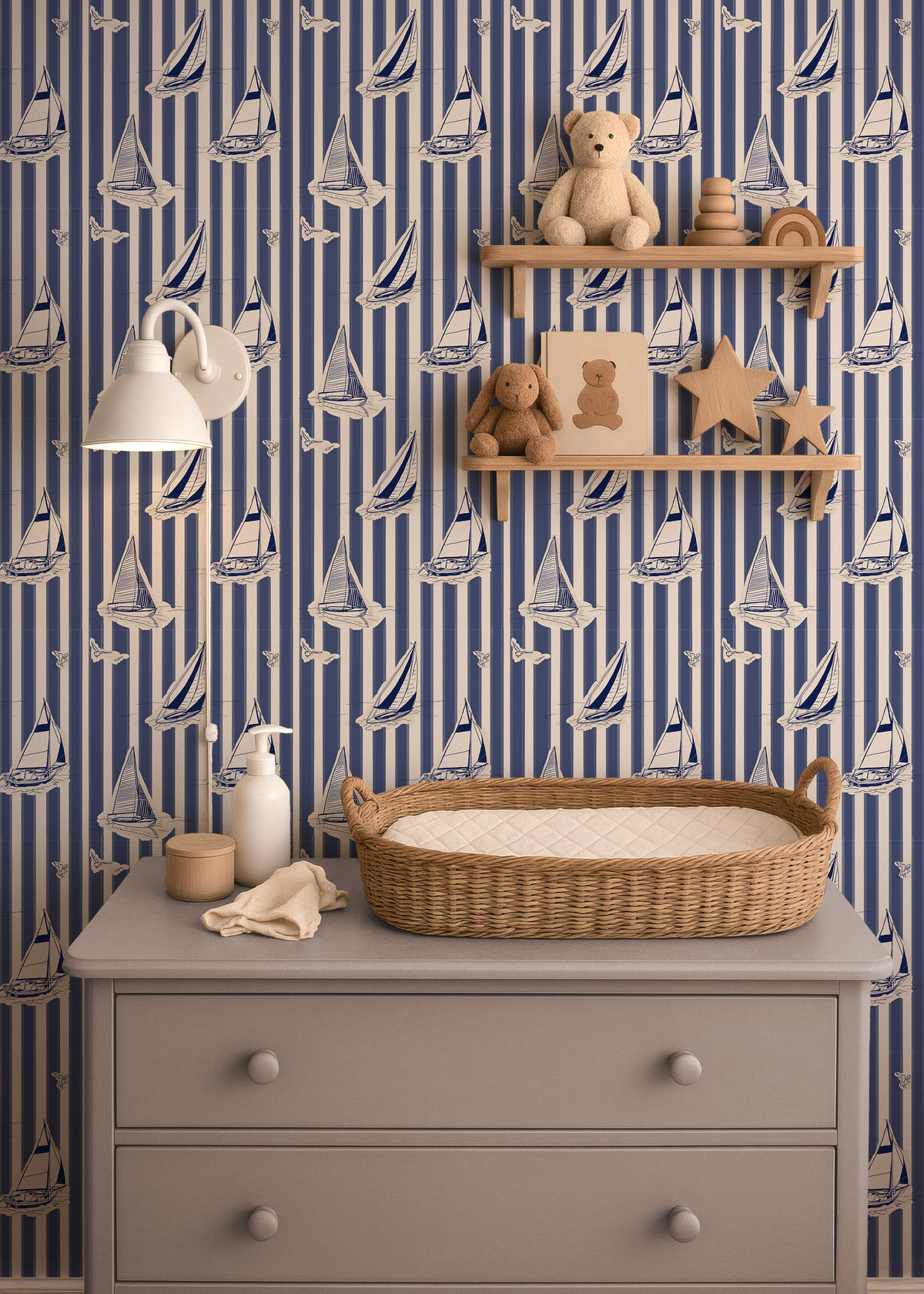 Blue sailboat wallpaper with cream stripes styled in a nautical nursery with wood shelves and changing table