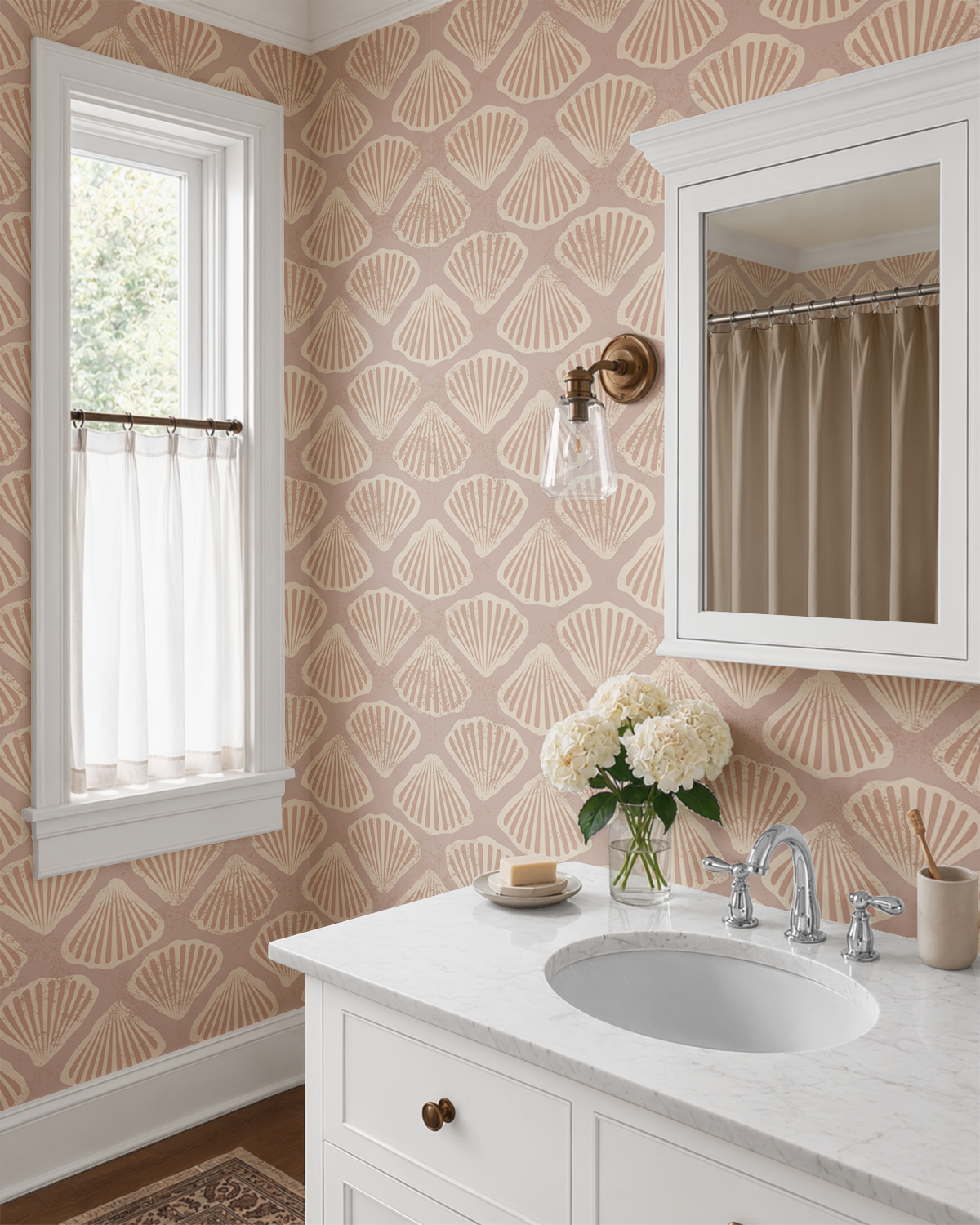 Sandy scallop shell wallpaper in a bathroom with white vanity and soft coastal decor