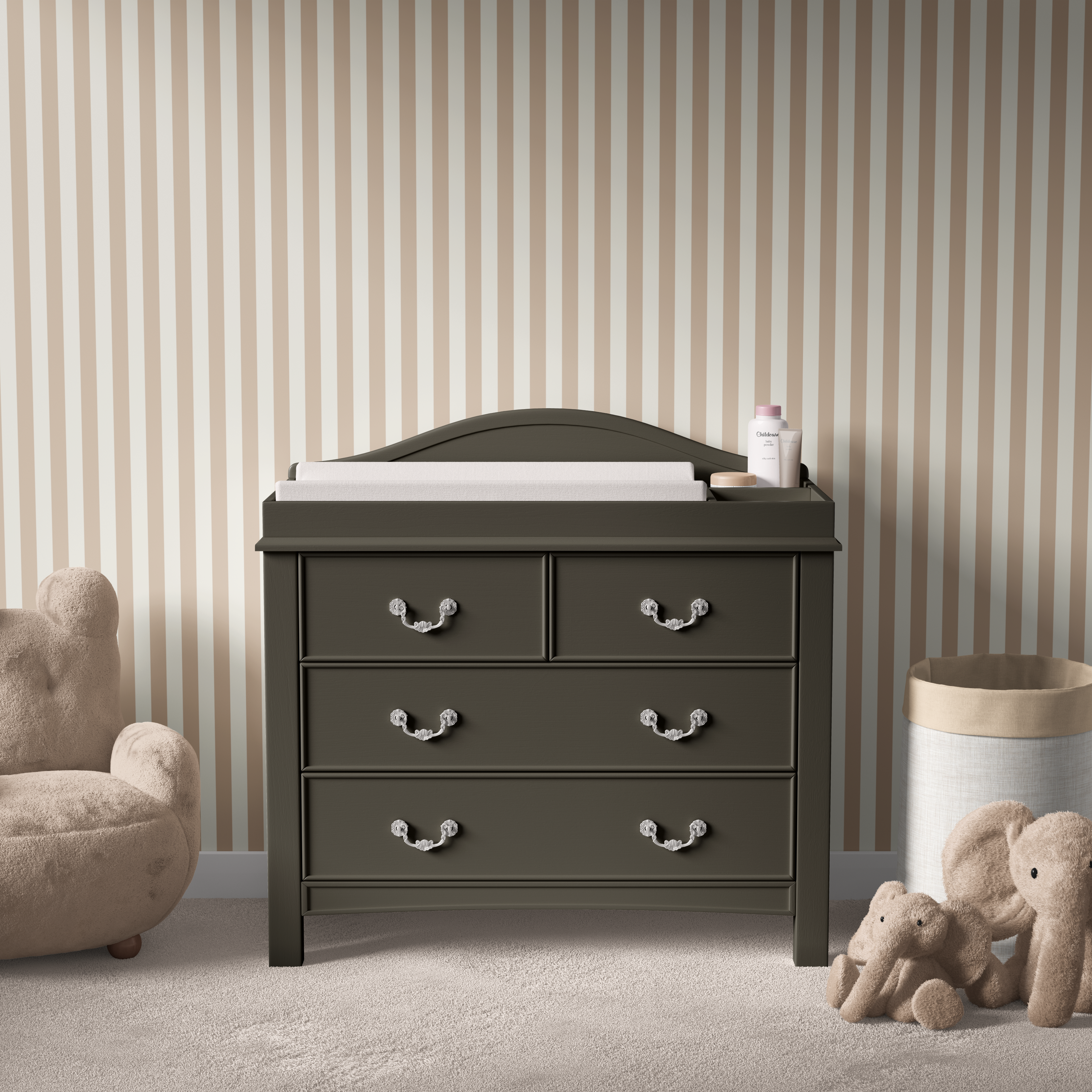 Sandstone striped wallpaper behind dark dresser in a gender-neutral nursery with plush toys