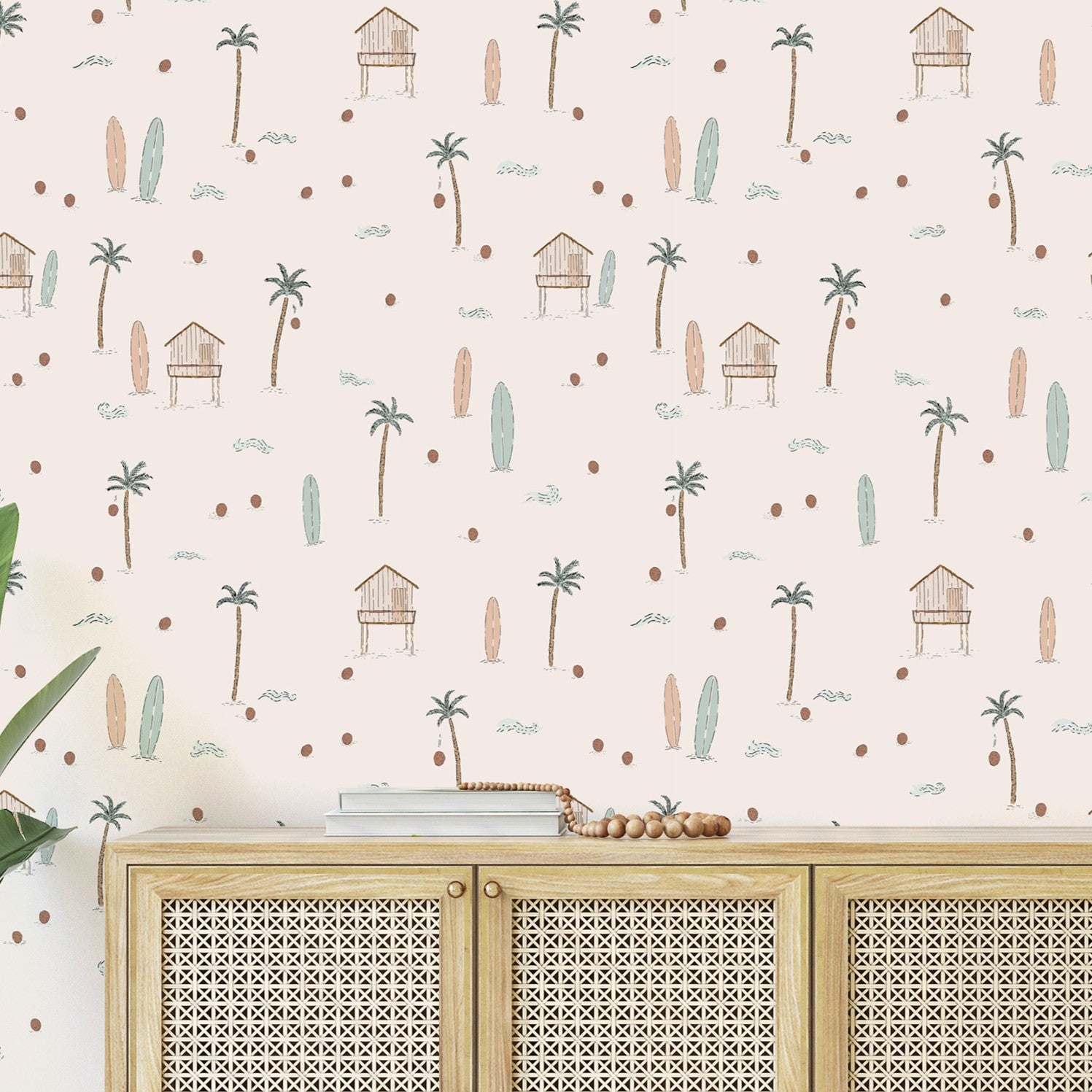 Wallpaper with beach-themed design featuring palm trees, huts, and surfboards on a light background. Below the wallpaper, there is a wooden cabinet.