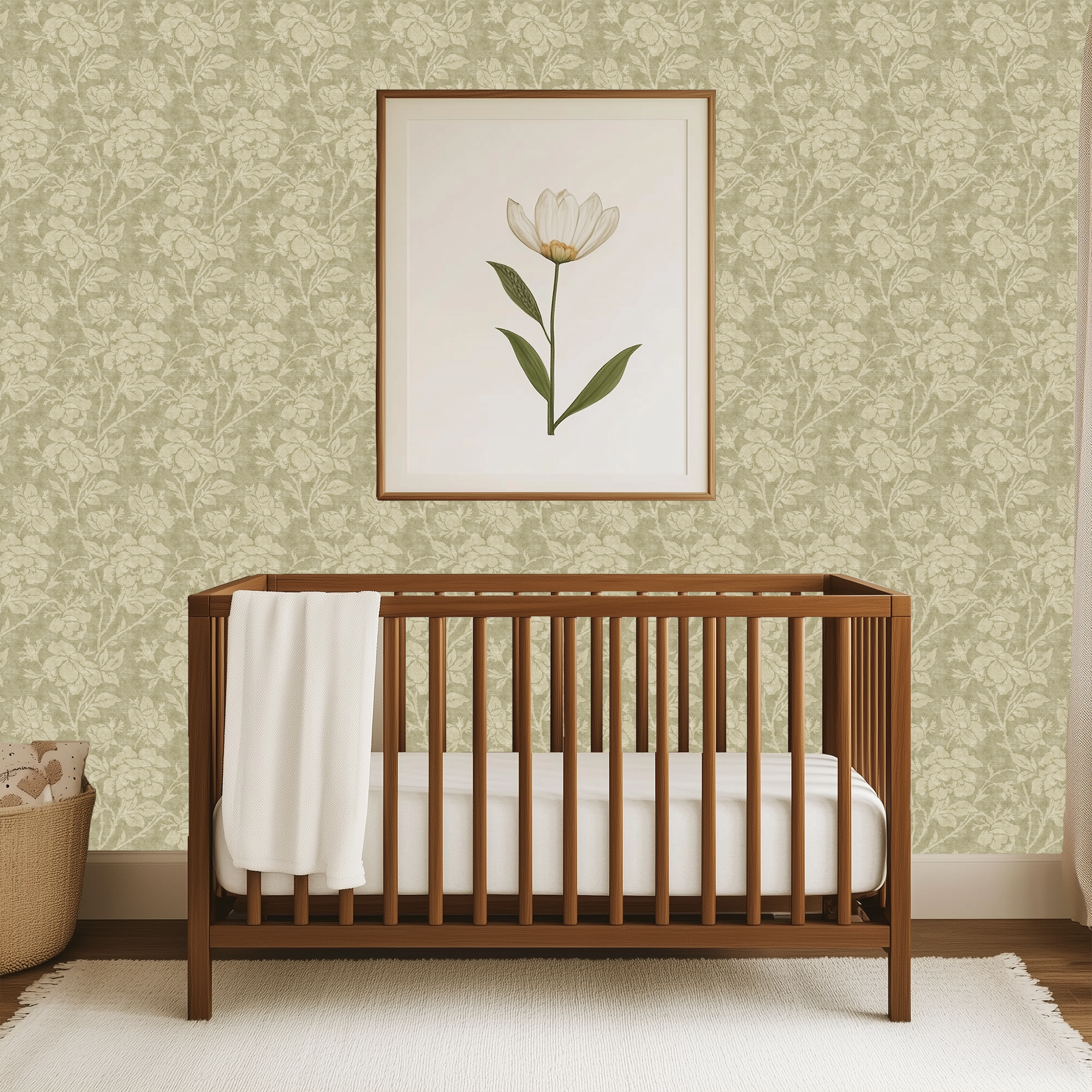Sage green floral wallpaper with antique-inspired rose pattern styled in a nursery with framed botanical art