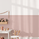 Pink removable wall paneling in a charming nursery setting