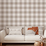 Neutral brown gingham wallpaper in cozy living room with cream sofa and accent pillows
