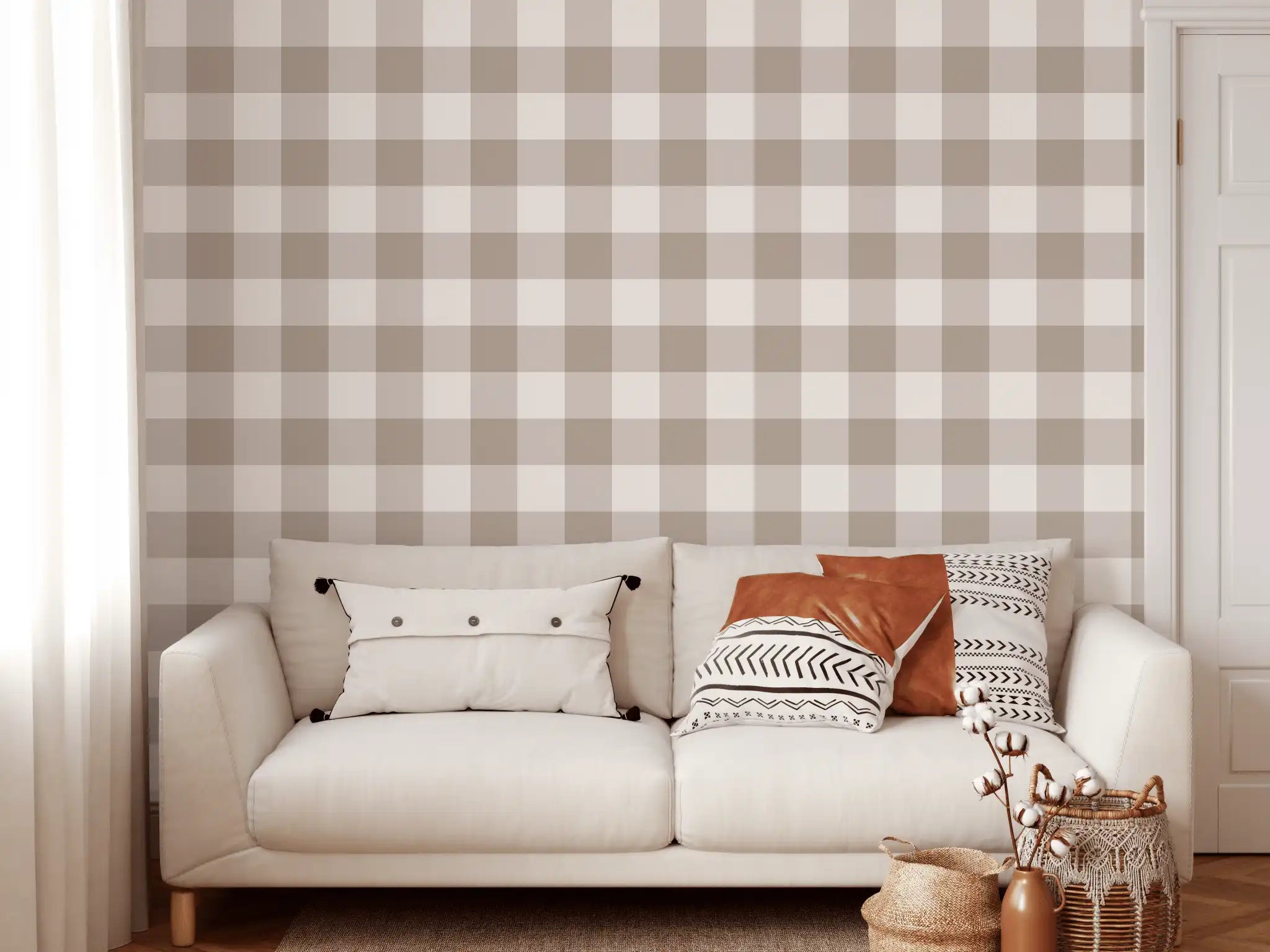 Neutral brown gingham wallpaper in cozy living room with cream sofa and accent pillows