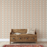 Neutral Western-themed wallpaper with cacti and horseshoes, styled in a classic entryway