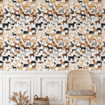 interior corner with a rattan chair and two wicker baskets beside it. The wall is covered with wallpaper featuring a variety of colorful dog illustrations.