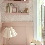 pink wainscotting and wallpaper