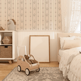 Floral vertical stripe wallpaper in a neutral-toned nursery
