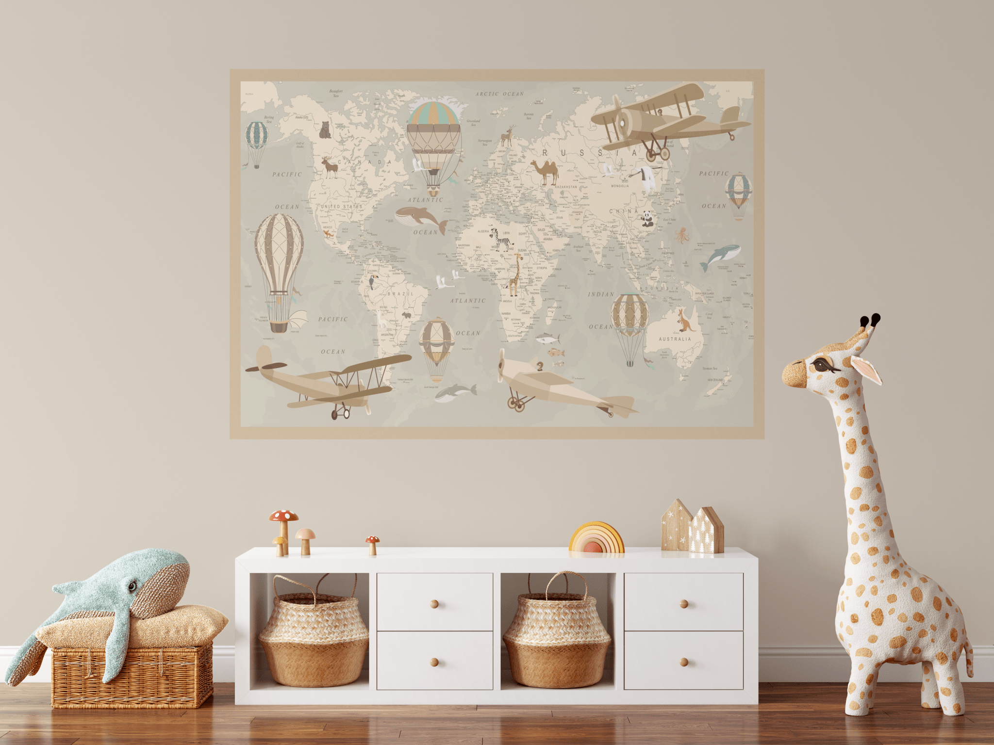 A cozy children's room with a soft toy giraffe, storage baskets, and a large removable world map wall decal adorned with vintage planes and hot air balloons. The decal serves as both decor and an educational feature for kids.