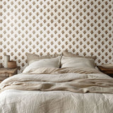 Rustic bedroom showcasing Regencycore floral wallpaper with warm tones.