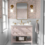 Vintage floral wallpaper in pink bathroom with blush vanity, gold fixtures, and wainscoting for an elegant botanical touch