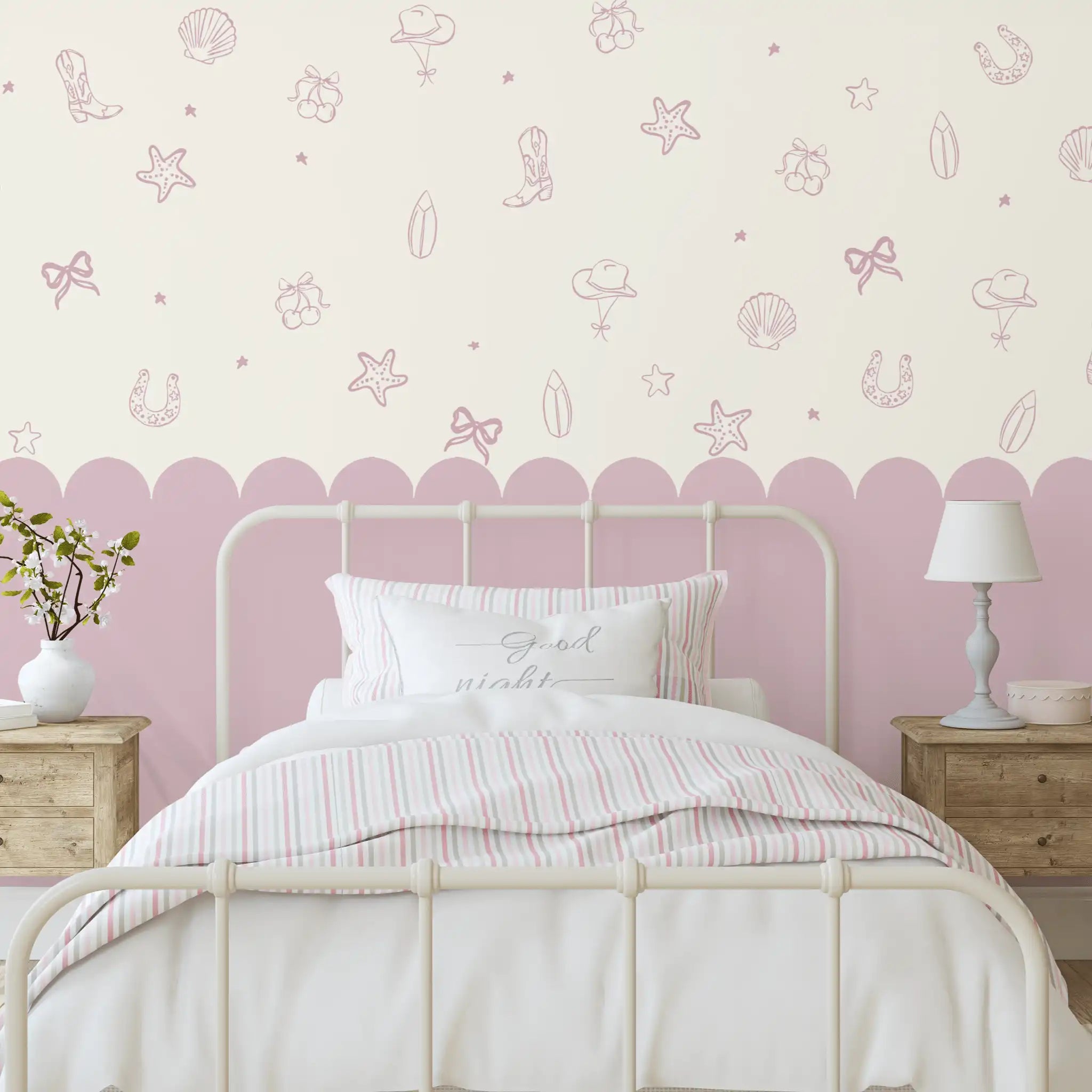 Mauve seaside cowgirl decals above a scalloped pink wall in a vintage-style bedroom