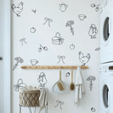 Farmhouse decals in laundry room with baskets and wood tones
