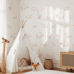 Rust-colored animal decals on white wall with a safari-themed teepee play area