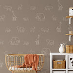 White safari wall decals on a warm wall with crib and panda-themed storage
