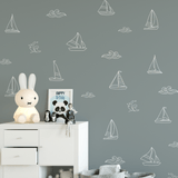 Nautical kids room with white outline decals on a dark blue wall and modern decor