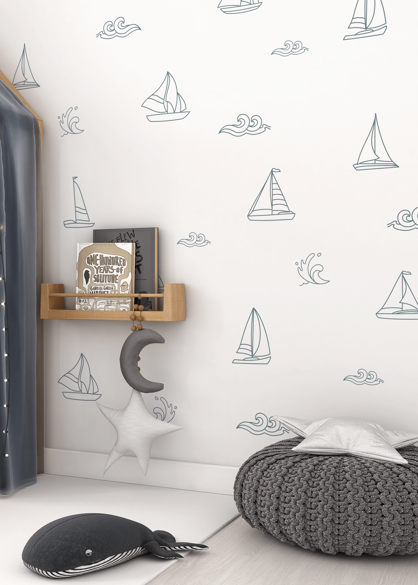 Sailboat and ocean wave wall decals in a cozy reading nook with a moon and star mobile
