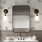 Minimalist bathroom featuring simple ocean animal wall decals in black outline, adding an elegant and whimsical underwater touch to the space."