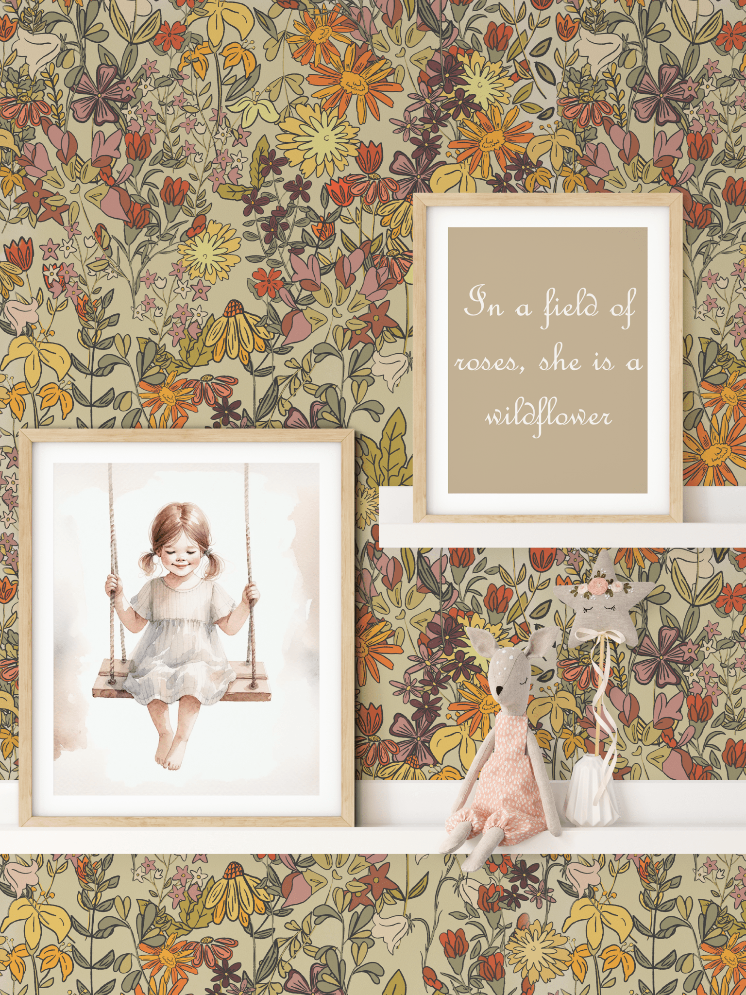 A girls' room with summertime floral wallpaper in bright colors, featuring framed artwork of a girl on a swing, a plush toy, and a quote, creating a cheerful and whimsical atmosphere.