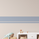 Kid's play area with light blue thick and thin stripe wall decals, adding a playful touch to the wall decor.