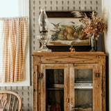 Rustic kitchen wall with Vintage Aster Wallpaper and vintage decor accents