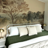 Bright daylight floods the bedroom, highlighting the detailed Vintage Landscape mural above the bed, accompanied by a mix of white and green pillows.